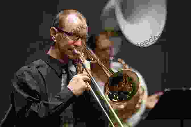 A Photograph Of A Trombone Player Performing On Stage. 101 Hit Songs For Trombone Jennifer Hamady